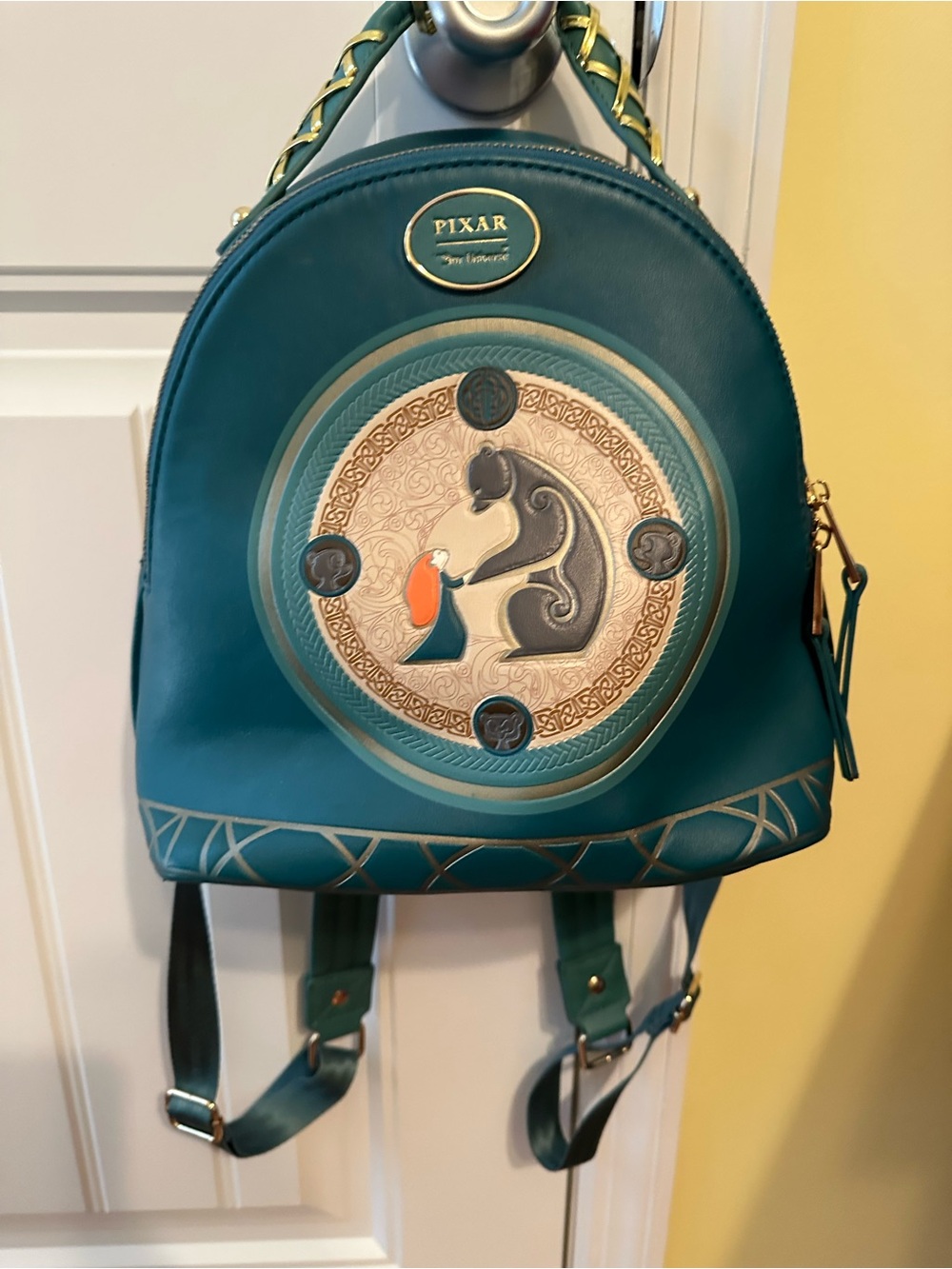 Our Universe Disney Pixar Brave DunBroch Family tapestry mini backpack.